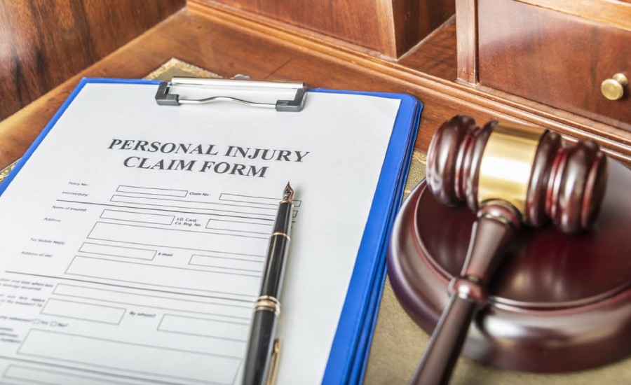 A personal injury claim form and a gavel