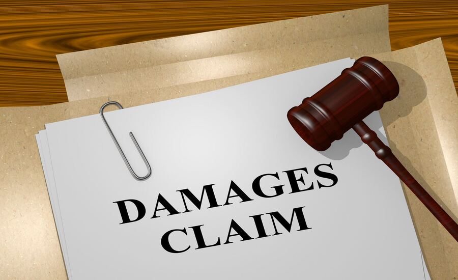 A damage claim document and a gavel