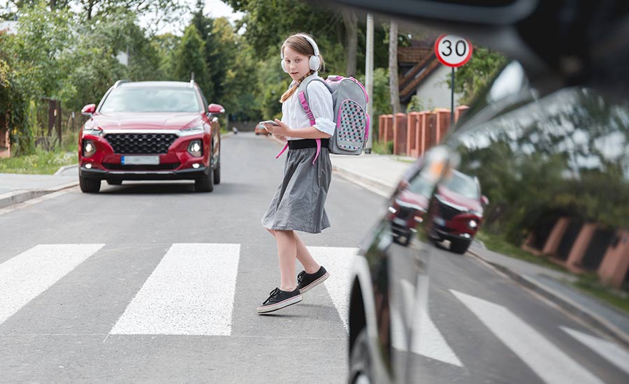  A girl crossing a street