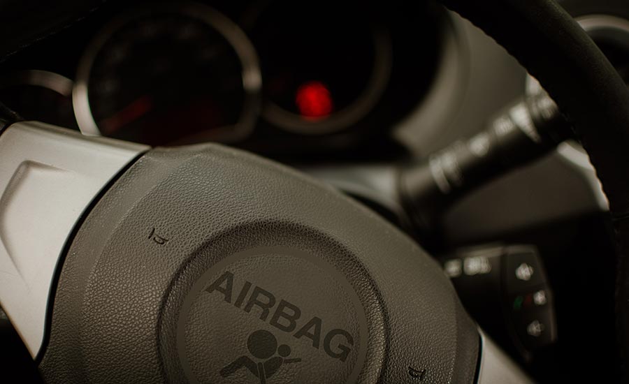 An airbag compartment in a motor vehicle