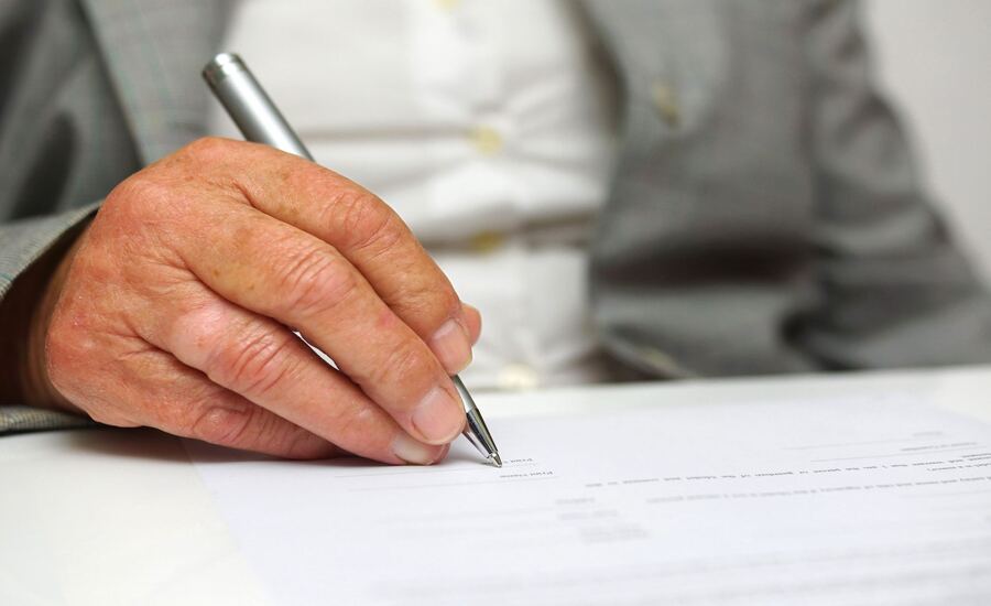 A man filing a supplemental report after a car accident