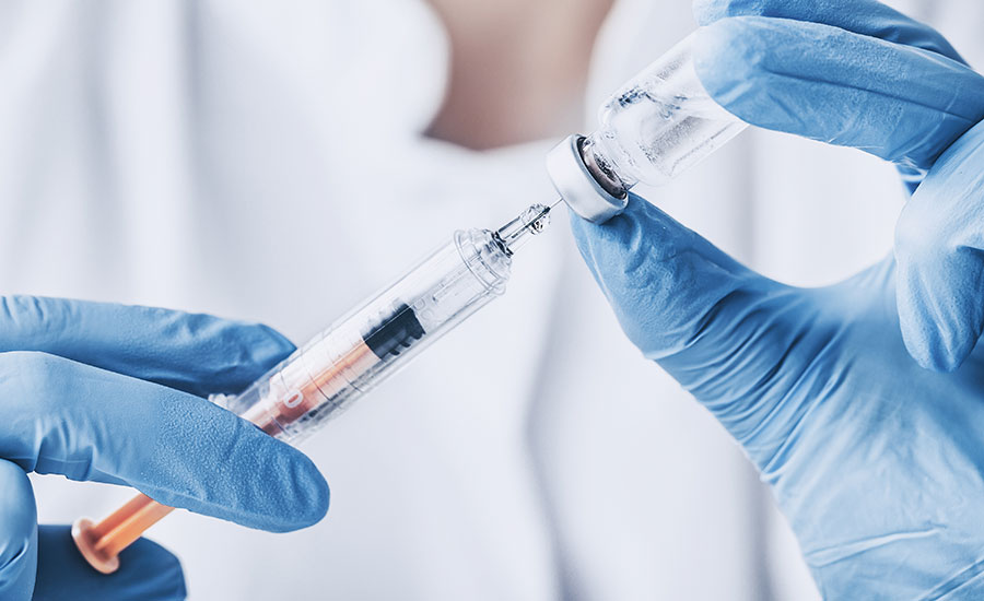 A doctor preparing to give a steroid injection