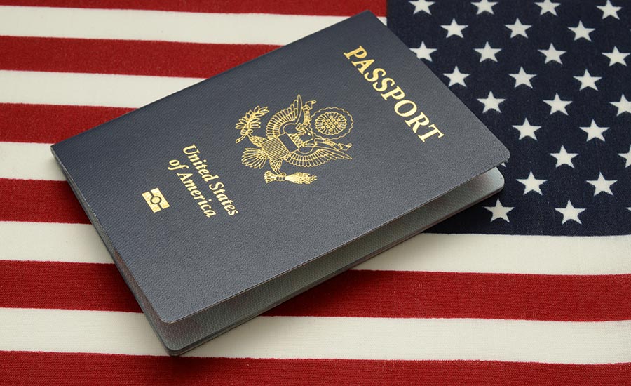 A U.S. passport and U.S. flag​