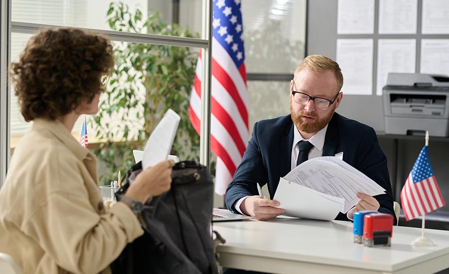 A woman at an interview at an U.S. Embassy​