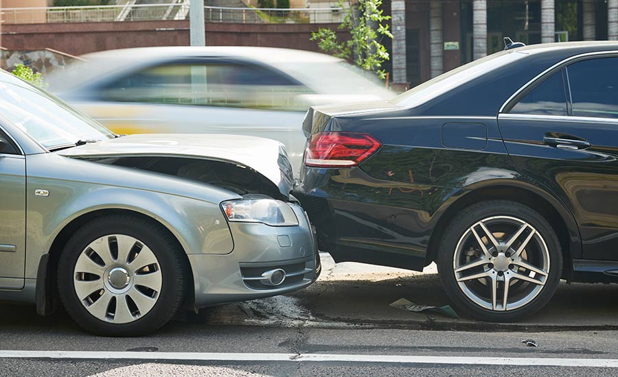 Damaged cars after a rear-end collision