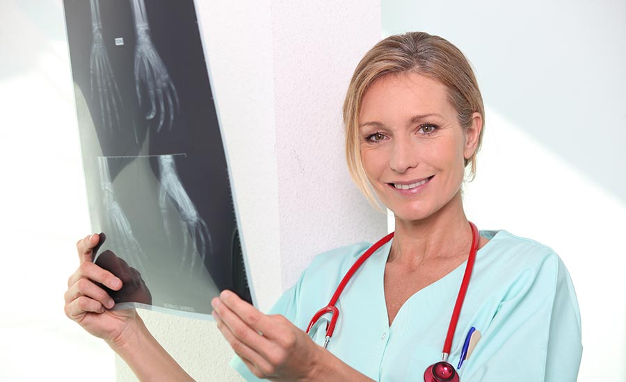 A doctor examining a patient's X-rays​