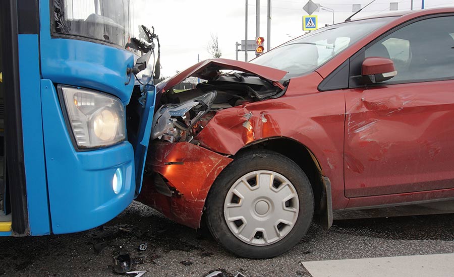 A collision between a bus and a car​