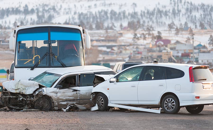 A bus and two cars after an accident on the road​